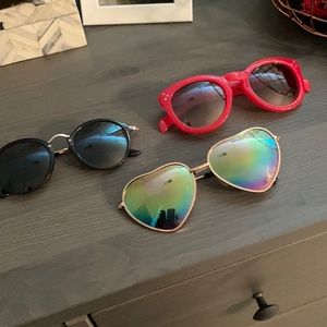 Three pair of fun costume sunglasses